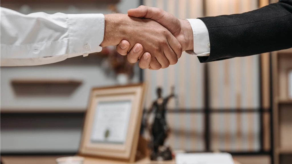 Lawyer and Client Shaking Hands