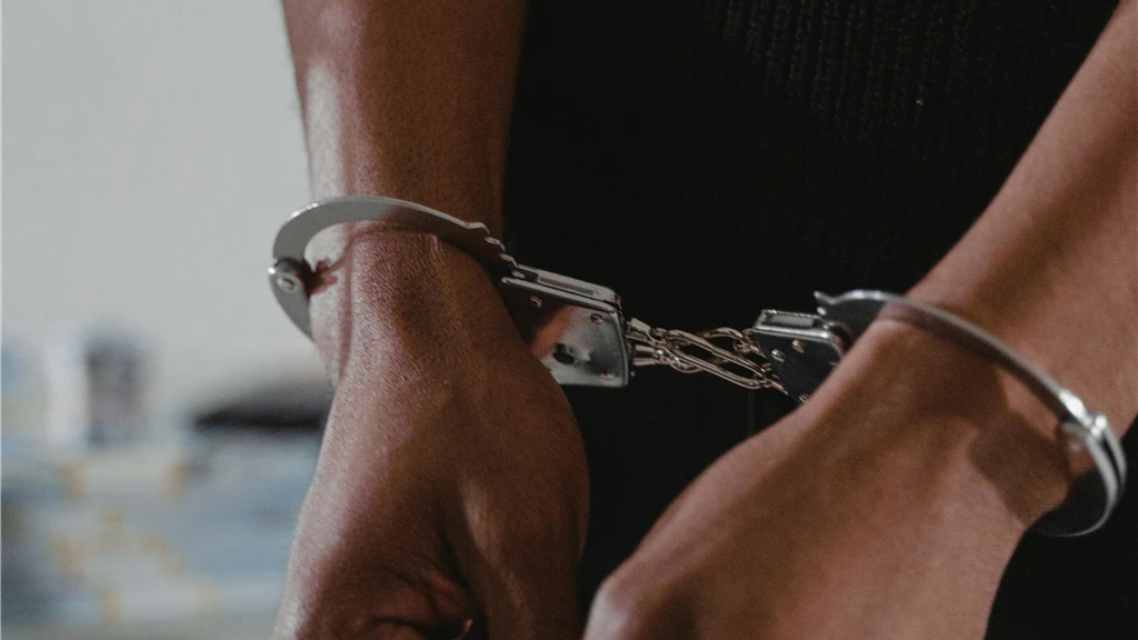 Persons Hands in Handcuffs